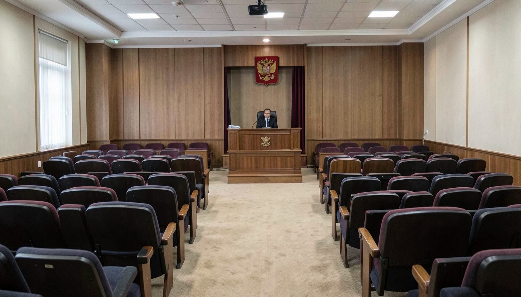 Зал заседаний городского совета, ряды кресел, трибуна, официальная обстановка, нейтральное освещение